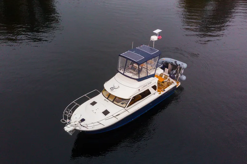 Halcyon Yacht Photos Pics Aerial view of 2016 Cutwater 30 CB boat on calm water.