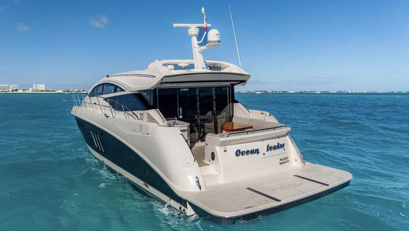  Yacht Photos Pics 2018 Sea Ray L590 yacht cruising on clear blue ocean waters.