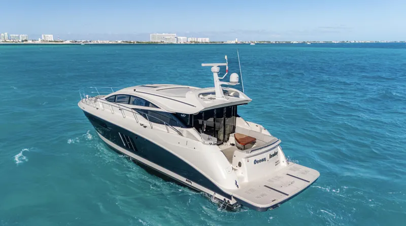  Yacht Photos Pics 2018 Sea Ray L590 yacht cruising on clear blue ocean waters.