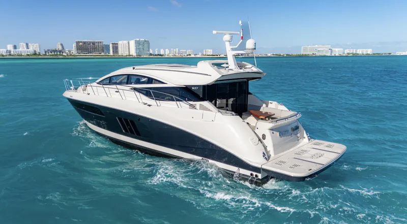  Yacht Photos Pics 2018 Sea Ray L590 yacht cruising in clear blue ocean waters.