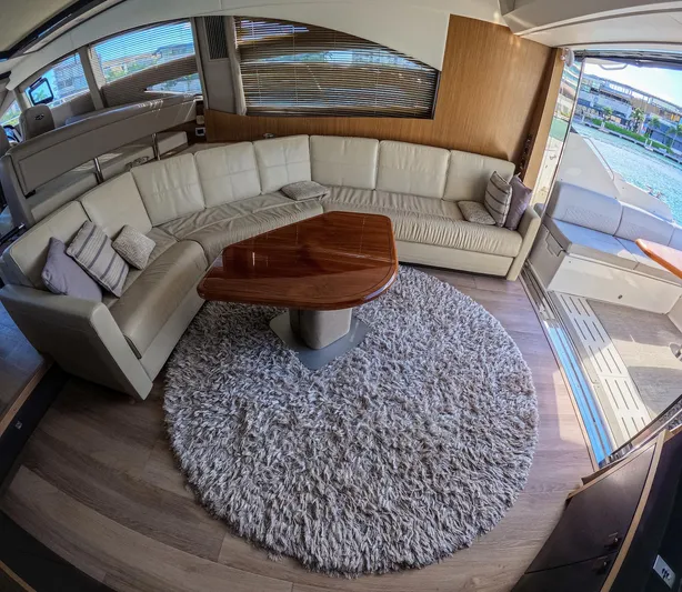  Yacht Photos Pics Luxurious 2018 Sea Ray L590 yacht interior with plush seating and elegant wooden table.