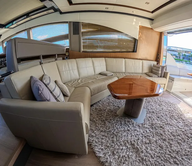  Yacht Photos Pics Luxurious interior of 2018 Sea Ray L590 yacht with plush seating and elegant decor.