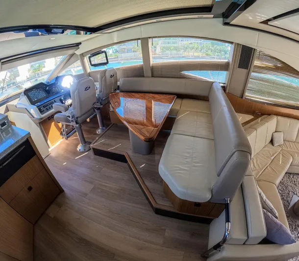  Yacht Photos Pics Luxurious interior of 2018 Sea Ray L590 yacht with plush seating and modern helm.