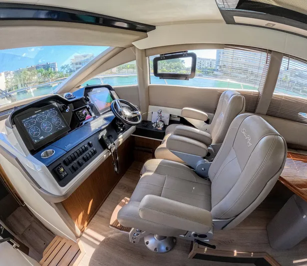  Yacht Photos Pics Luxurious 2018 Sea Ray L590 yacht cockpit with modern controls and plush seating.
