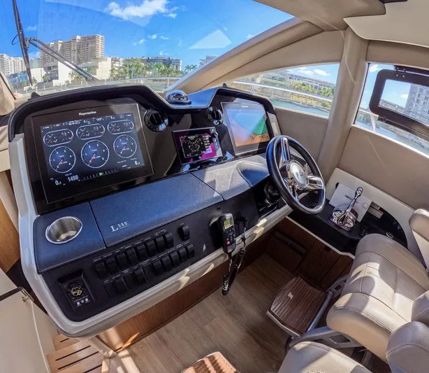  Yacht Photos Pics 2018 Sea Ray L590 yacht helm with modern navigation displays and luxurious interior.