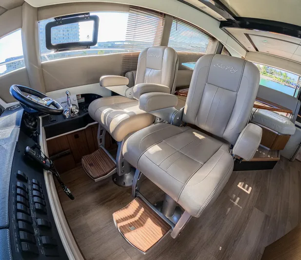  Yacht Photos Pics Luxurious 2018 Sea Ray L590 yacht interior with plush captain's chairs and modern helm.