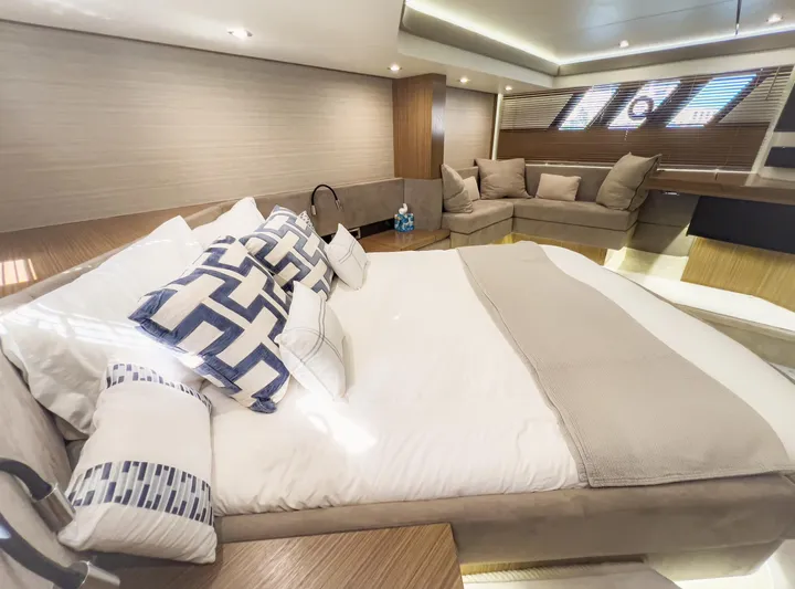 Yacht Photos Pics Luxurious interior of 2018 Sea Ray L590 yacht with elegant bedding and seating area.