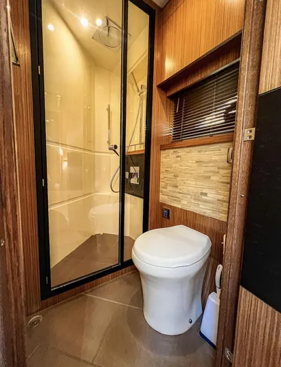  Yacht Photos Pics Luxurious bathroom in 2018 Sea Ray L590 yacht with modern shower and toilet.