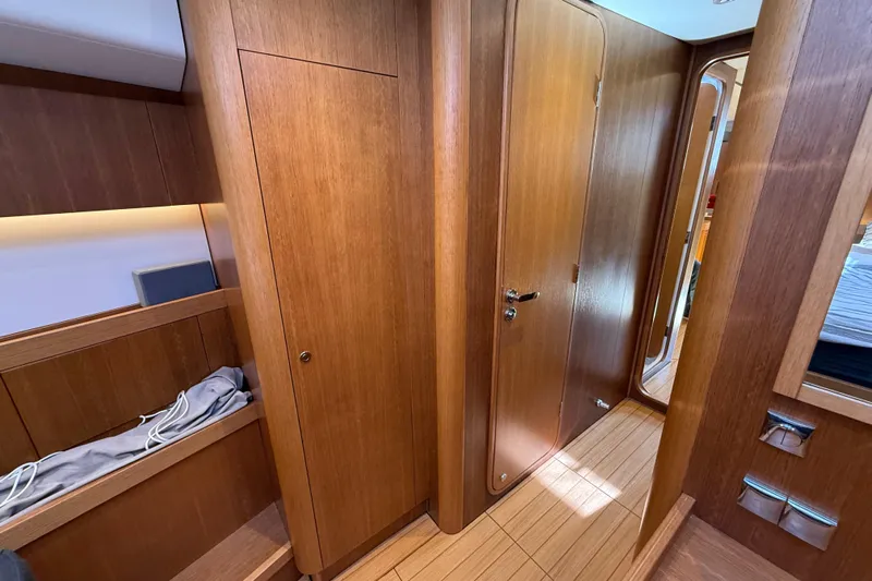 Pau Hana Yacht Photos Pics Luxurious wooden interior of 2019 Nautor Swan 54 yacht cabin hallway.