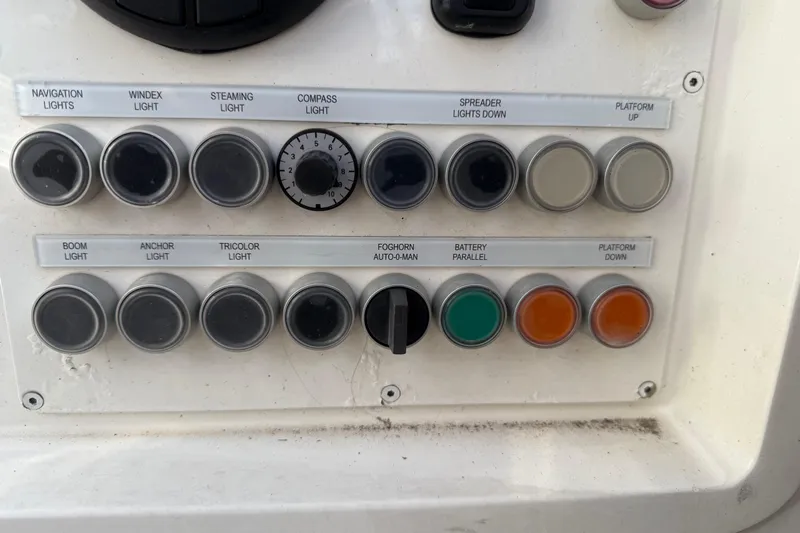 Pau Hana Yacht Photos Pics Control panel of a 2019 Nautor Swan 54 yacht with labeled buttons and switches.