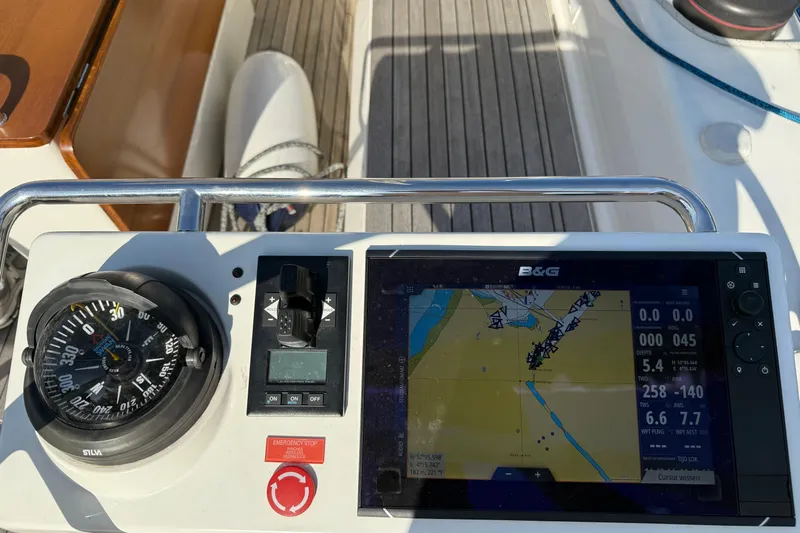 Pau Hana Yacht Photos Pics Cockpit of 2019 Nautor Swan 54 yacht with navigation display and compass.