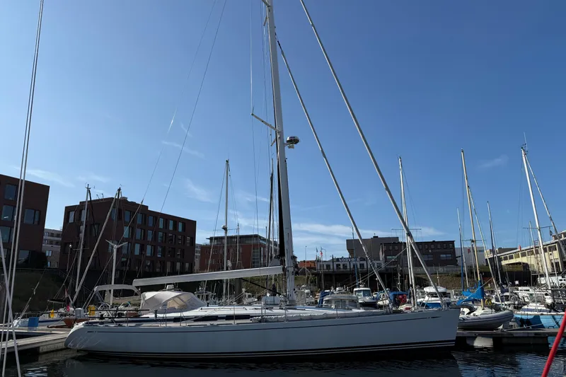 Pau Hana Yacht Photos Pics 2019 Nautor Swan 54 yacht docked in marina under clear blue sky.