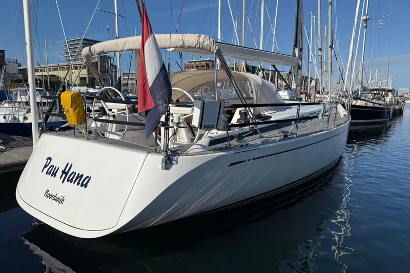 Pau Hana Yacht Photos Pics Nautor Swan 54 yacht, 2019 model, docked in a marina under clear blue skies.
