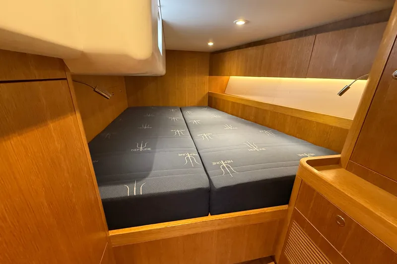Pau Hana Yacht Photos Pics Luxurious cabin interior of 2019 Nautor Swan 54 yacht with comfortable bedding.