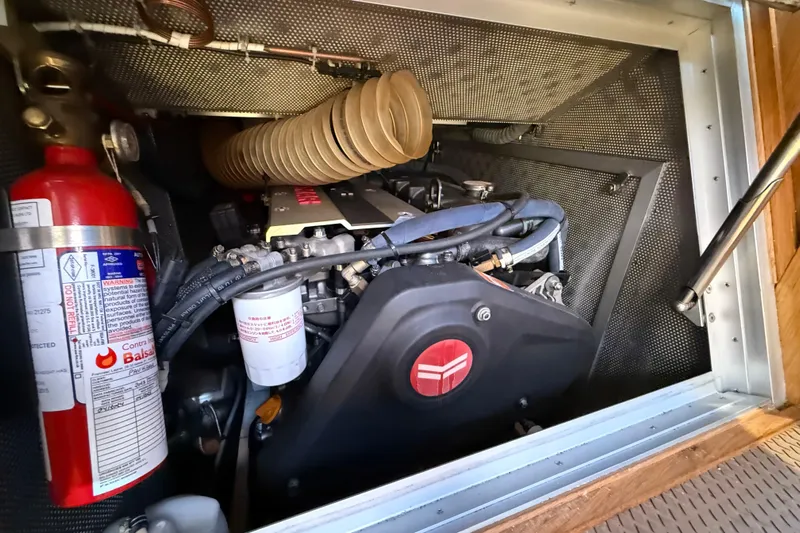 Pau Hana Yacht Photos Pics Engine compartment of 2019 Nautor Swan 54 yacht with visible fire extinguisher.