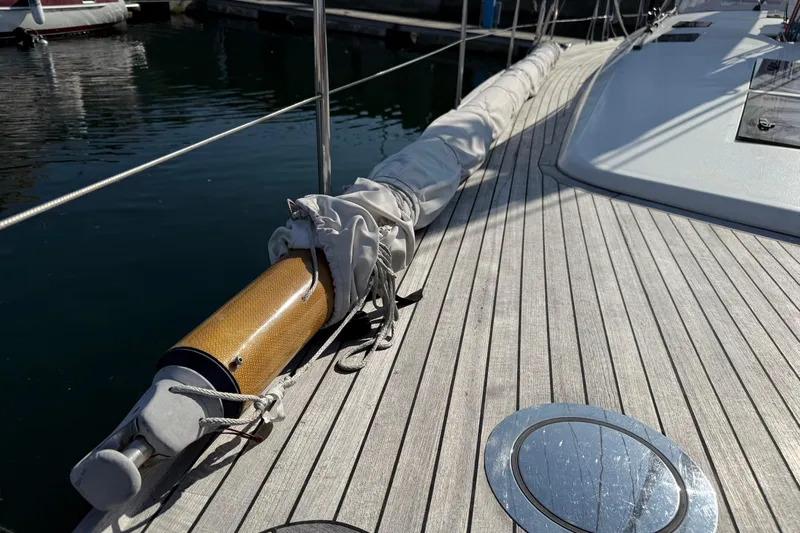 Pau Hana Yacht Photos Pics Deck of 2019 Nautor Swan 54 yacht with wrapped sail and wooden details.