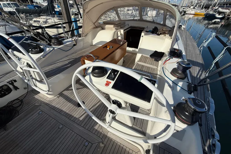 Pau Hana Yacht Photos Pics Cockpit of 2019 Nautor Swan 54 yacht with dual steering wheels and teak decking.