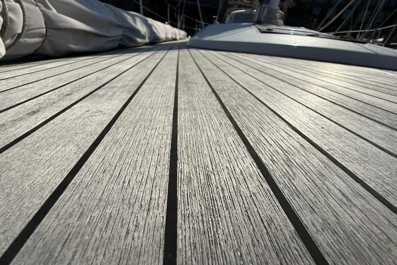Pau Hana Yacht Photos Pics Teak deck of 2019 Nautor Swan 54 yacht, showcasing elegant wood grain texture.