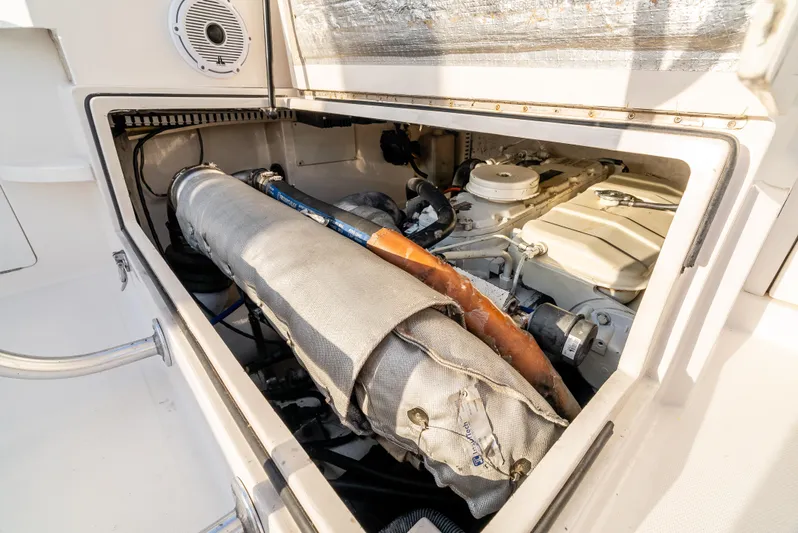 More Good Yacht Photos Pics Engine compartment of a 2002 Cabo 35 Flybridge boat, showcasing mechanical components.