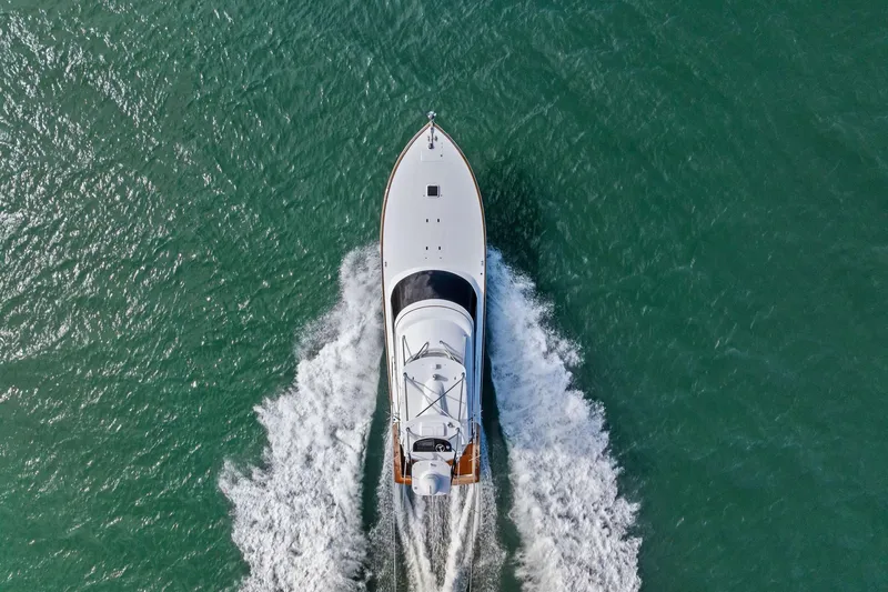 Knot Haulin Yacht Photos Pics Aerial view of 2017 Spencer Convertible yacht cruising on open water.