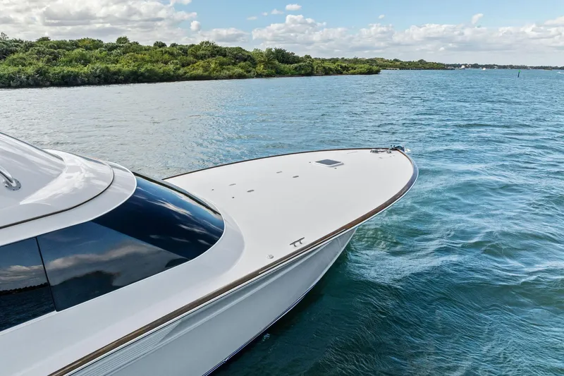 Knot Haulin Yacht Photos Pics 2017 Spencer Convertible yacht cruising on a serene blue lake.