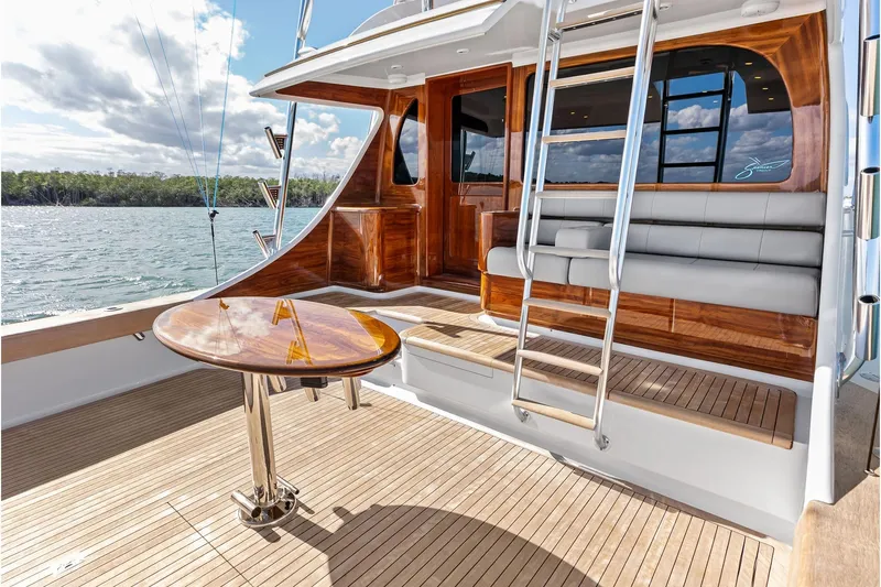 Knot Haulin Yacht Photos Pics Luxurious 2017 Spencer Convertible yacht deck with wooden table and seating.