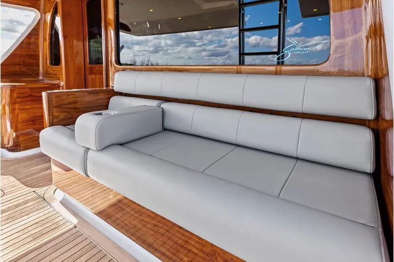 Knot Haulin Yacht Photos Pics Luxurious seating on 2017 Spencer Convertible yacht with wooden accents and modern design.
