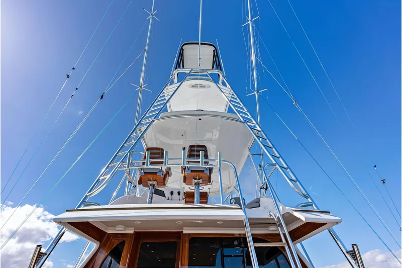 Knot Haulin Yacht Photos Pics 2017 Spencer Convertible yacht with tower against clear blue sky.