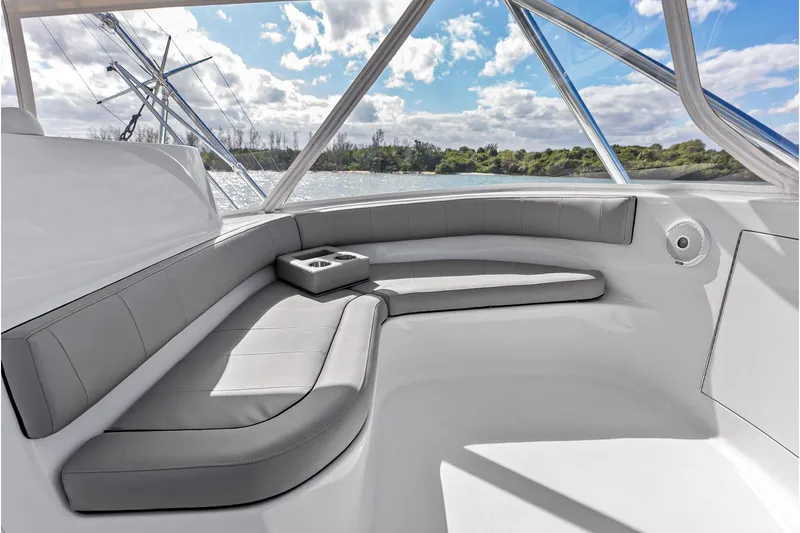 Knot Haulin Yacht Photos Pics Luxurious seating area on a 2017 Spencer Convertible boat, with scenic water view.