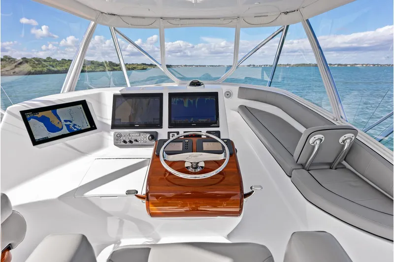 Knot Haulin Yacht Photos Pics 2017 Spencer Convertible yacht helm with navigation screens and luxurious seating.