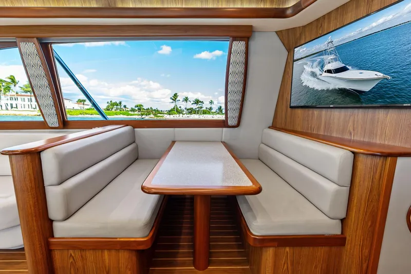 Knot Haulin Yacht Photos Pics Luxurious 2017 Spencer Convertible yacht interior with elegant seating and scenic window view.
