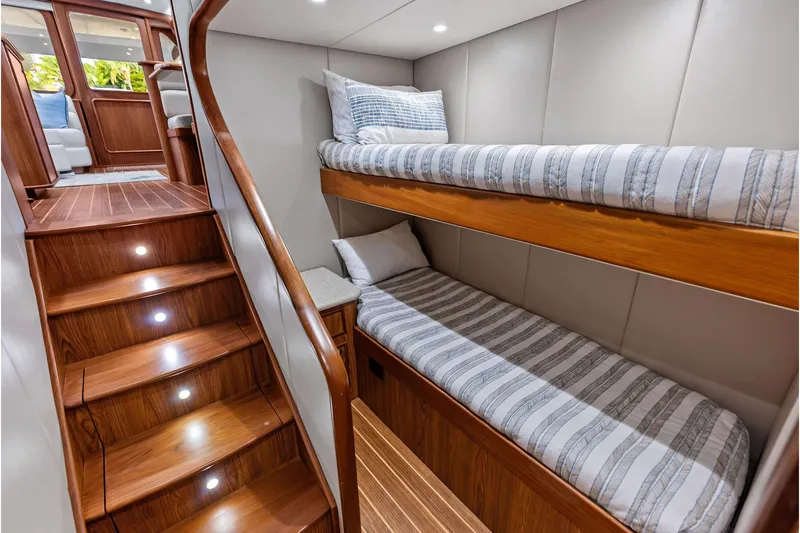 Knot Haulin Yacht Photos Pics Luxurious 2017 Spencer Convertible yacht interior with wooden stairs and cozy bunk beds.