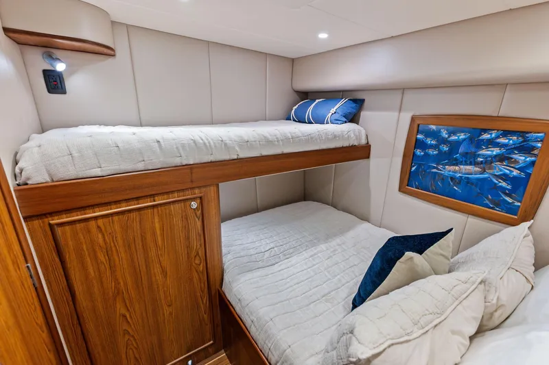 Knot Haulin Yacht Photos Pics Luxurious 2017 Spencer Convertible cabin with bunk beds and marine-themed decor.