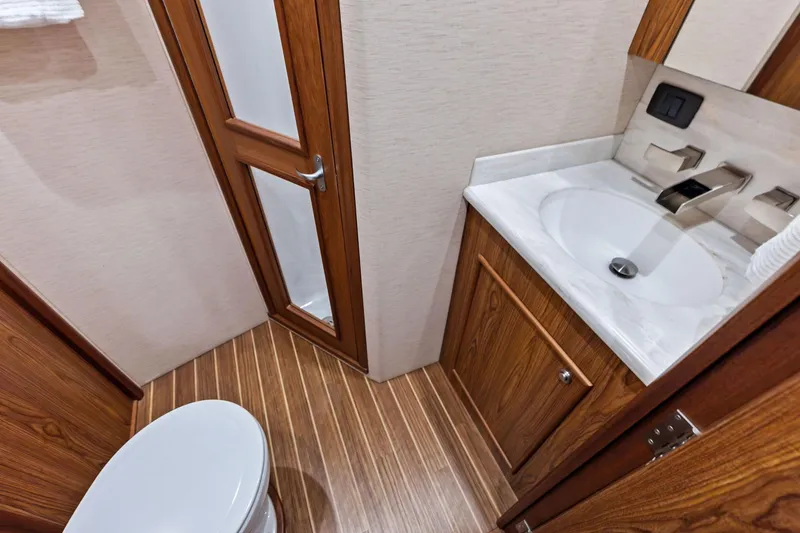 Knot Haulin Yacht Photos Pics Luxurious 2017 Spencer Convertible bathroom with wood accents and modern fixtures.