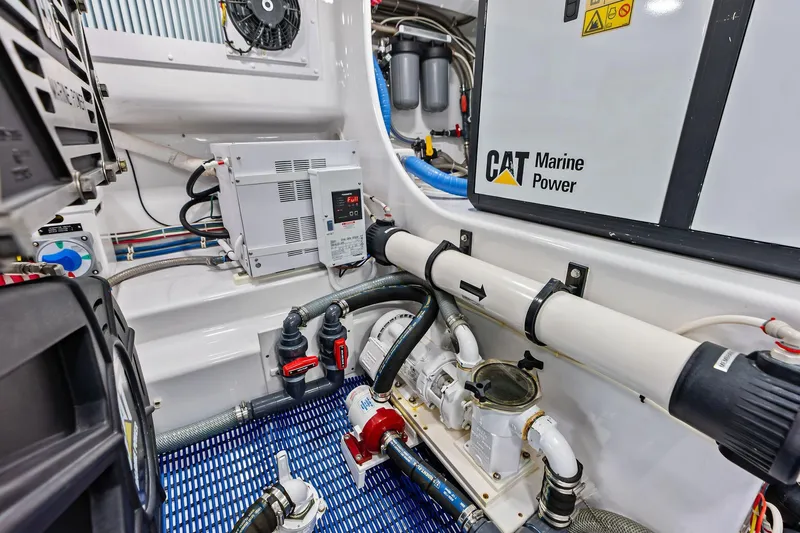 Knot Haulin Yacht Photos Pics Engine room of 2017 Spencer Convertible with CAT Marine Power system and various mechanical components.