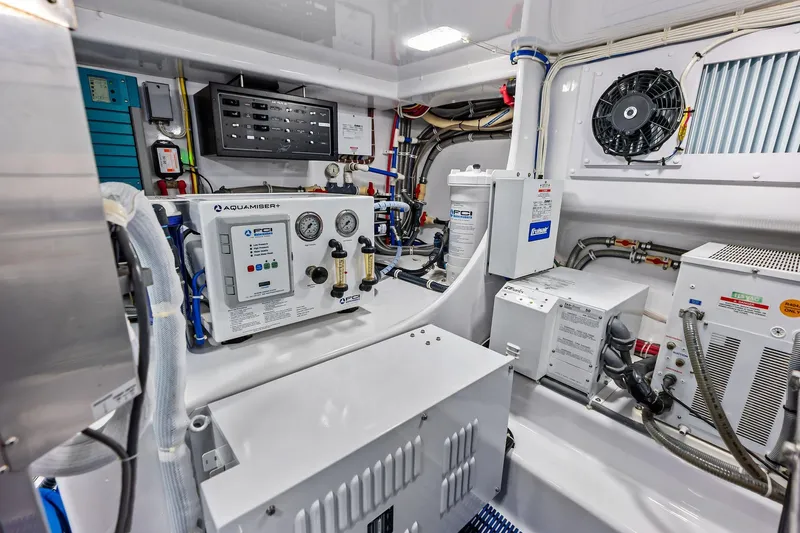 Knot Haulin Yacht Photos Pics Engine room of a 2017 Spencer Convertible with advanced control panels and equipment.