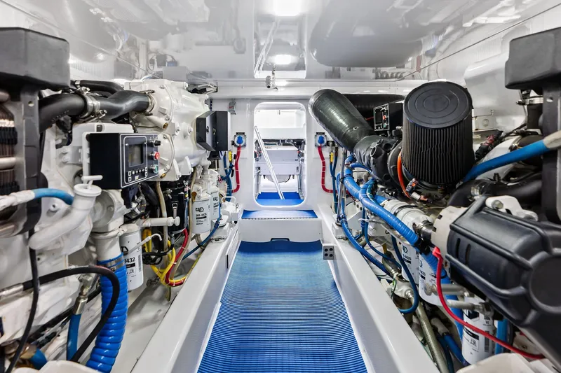 Knot Haulin Yacht Photos Pics Engine room of a 2017 Spencer Convertible yacht, showcasing advanced machinery and equipment.