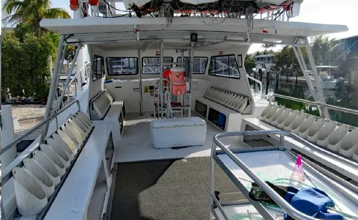  Yacht Photos Pics Newton 46 Dive Special boat interior, 2004 model, featuring seating and diving equipment storage.