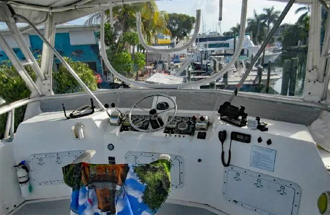  Yacht Photos Pics Cockpit view of 2004 Newton 46 Dive Special boat at a marina.