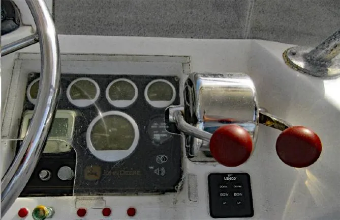  Yacht Photos Pics Control panel of a 2004 Newton 46 Dive Special boat with gauges and levers.