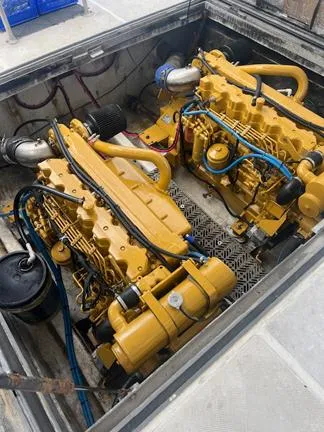  Yacht Photos Pics Engine room of a 2004 Newton 46 Dive Special with dual yellow engines.