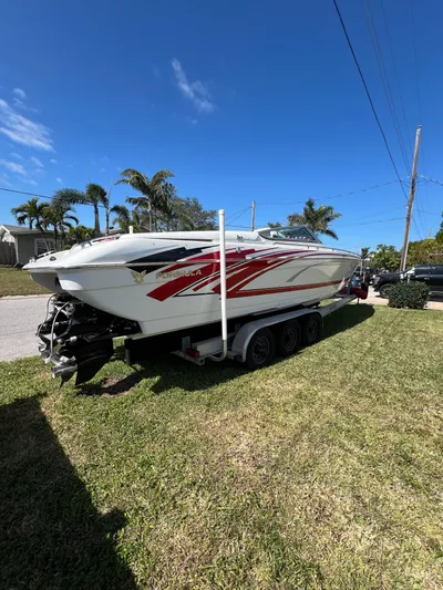  Yacht Photos Pics 2016 Formula 353 FASTech boat on trailer, parked on grass under clear blue sky.