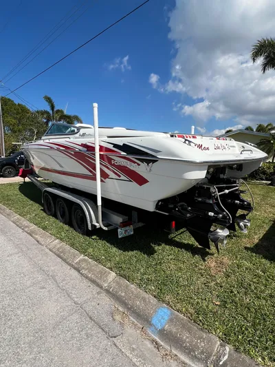  Yacht Photos Pics 2016 Formula 353 FASTech boat on trailer, parked on grass under a clear blue sky.
