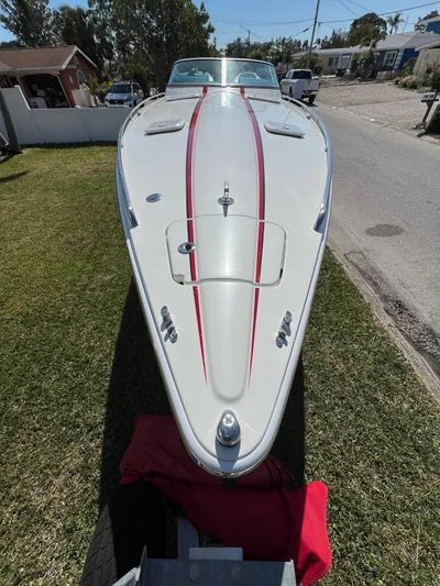  Yacht Photos Pics 2016 Formula 353 FASTech boat with sleek design and red accents, parked on grass.