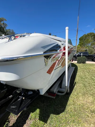  Yacht Photos Pics 2016 Formula 353 FASTech boat on trailer, parked on grass under clear blue sky.