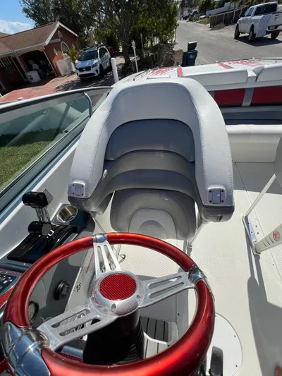 Yacht Photos Pics 2016 Formula 353 FASTech boat interior with red steering wheel and white seating.