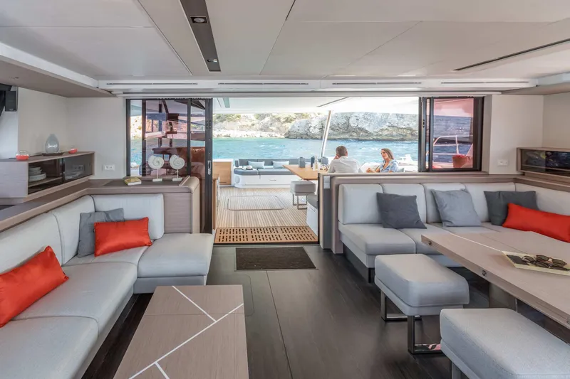  Yacht Photos Pics Luxurious interior of 2026 Fountaine Pajot Samana 59 yacht with modern seating and ocean view.
