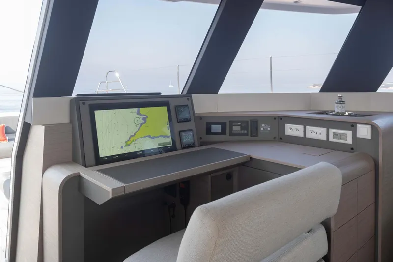  Yacht Photos Pics Modern helm station of 2026 Fountaine Pajot Samana 59 yacht with navigation equipment.