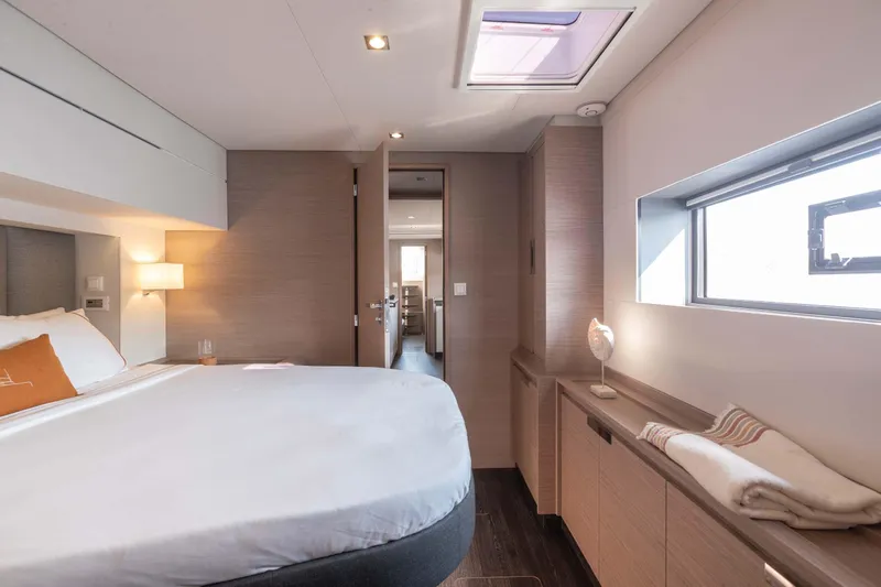  Yacht Photos Pics Luxurious cabin interior of 2026 Fountaine Pajot Samana 59 yacht, featuring modern design and cozy ambiance.