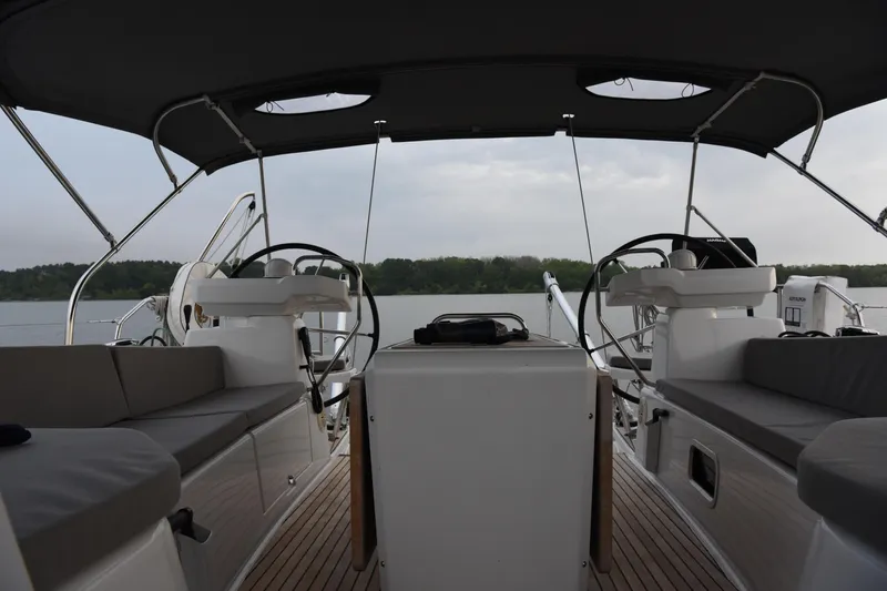 Recovery Room Yacht Photos Pics 2019 Jeanneau 51 yacht cockpit with dual steering wheels and cushioned seating.